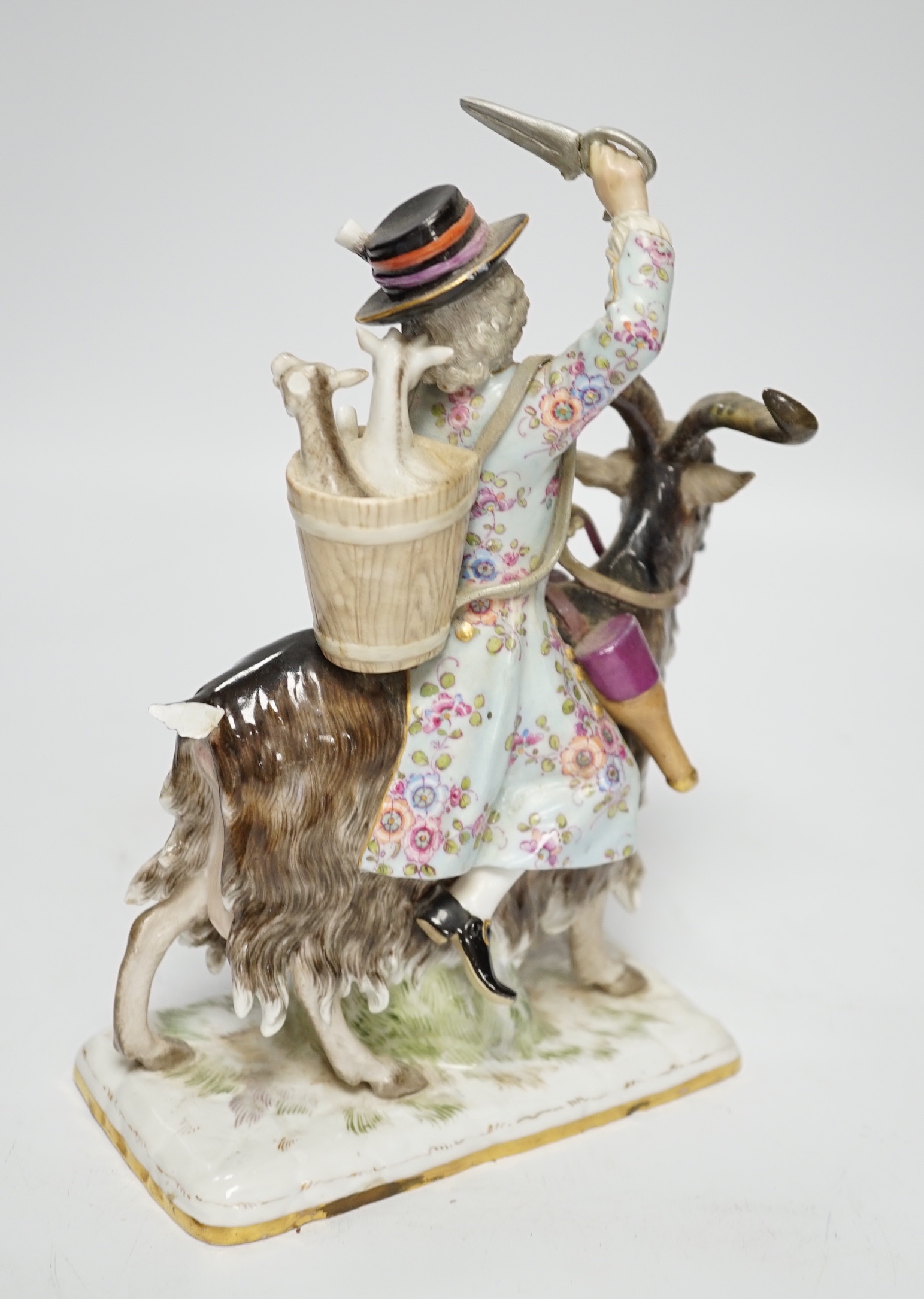 A Meissen group of Count von Bruhl’s tailor riding a goat, 19th century, 22cms high